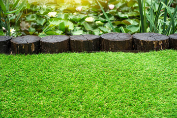 Artificial turf background. Landscape design with using of the soft artificial grass.