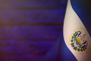 El Salvador flag for honour of veterans day or memorial day. Glory to the El Salvador heroes of war concept on blue blurred painted brick wall background.