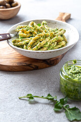 Pasta Lorighittas of Sardinia. Loriguittas with herb sauce pesto. in White plate.