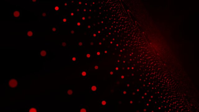 Red dots of various sizes and shades grow and shrink in size against a black background. Looping animation. 
