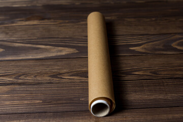 roll of baking paper on a wooden table.