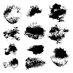 Abstract smears of black paint spots set on white paper