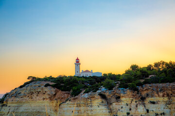 lighthouse at the Algarve coast in Carvoeiro, Portugal