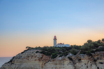 Fototapeta na wymiar lighthouse at the Algarve coast in Carvoeiro, Portugal