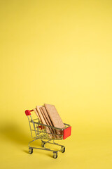 Metal basket with diet bread on a yellow isolated background with space for text