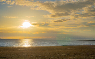 Naklejka na ściany i meble Sunrise sea beach sky landscape. Beautiful sun light reflection.