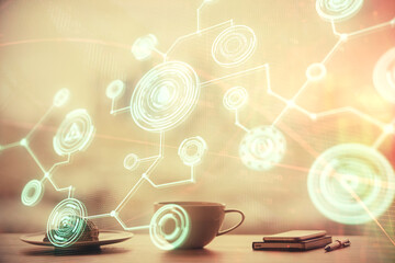Obraz premium Double exposure of social network theme drawing hologram over coffee cup background in office. Concept people connection.