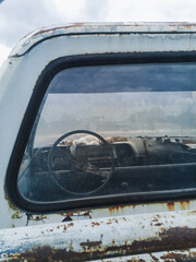 Fototapeta na wymiar Front of the dashboard of an abandoned vehicle