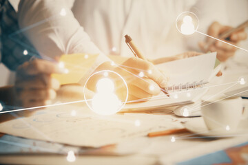 Double exposure of social network theme drawing over people taking notes background. Concept of human connection