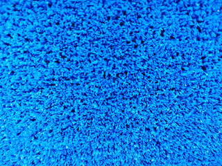 Fototapeta na wymiar blue plastic flooring artificial imitation of grass for the background