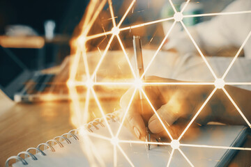 Double exposure of social network theme drawing over people taking notes background. Concept of...