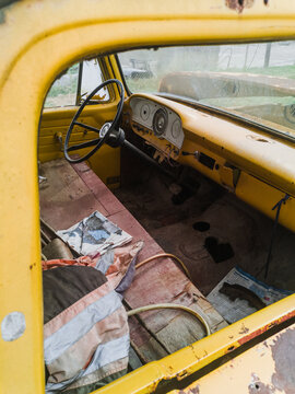 Car dashboard abandoned by a window