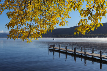 fishing dock on lake george at fall time