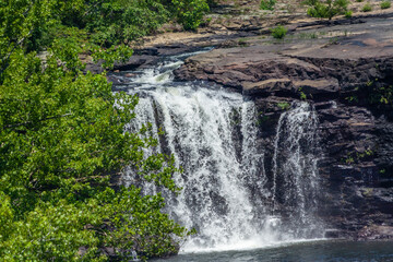 Fototapeta na wymiar telephoto view of water flowing over Little River Falls in Little River Canyon National Preserve, Alabama, USA
