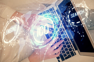 Double exposure of woman hands working on computer and blockchain theme hologram drawing. Top View. bitcoin cryptocurrency concept.