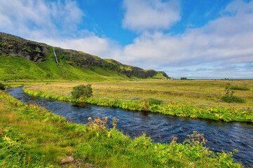 Fototapeta premium Creek of Seljalandfoss on a beautiful morning, Iceland