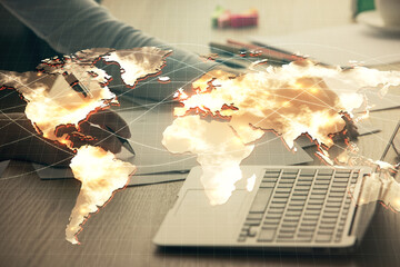 Multi exposure of woman hands typing on computer and business theme hologram drawing. Success...