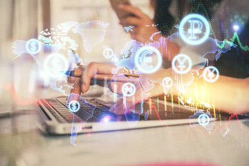 Multi exposure of woman hands typing on computer and financial graph hologram drawing. Stock market analysis concept.