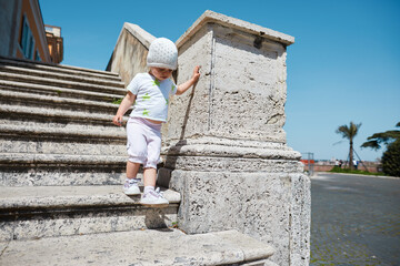 little girl on the old stairs