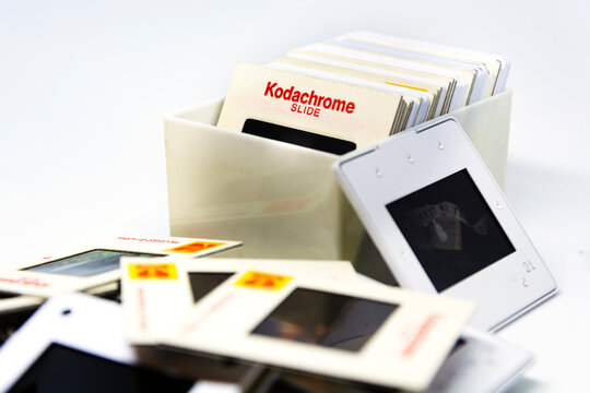 A group of Kodachrome brand slides from the 70s inside a plastic box.