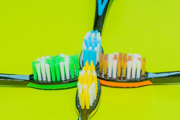 Closeup of four toothbrushes