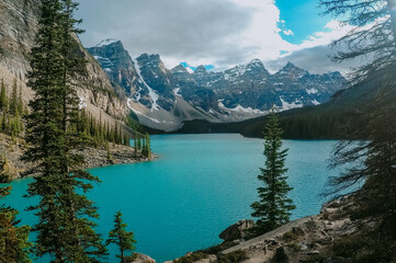 Fototapeta na wymiar Breathtaking view of turquoise water of Moraine Lake, tourist popular attraction/destination in Canadian Rockies, Banff National Park, Alberta, Canada