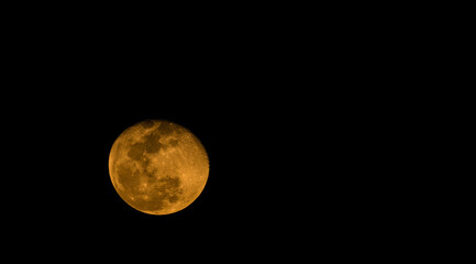 Waning gibbons moon in night sky