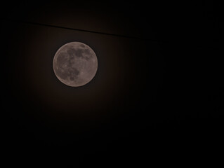 June full moon surrounded by a halo