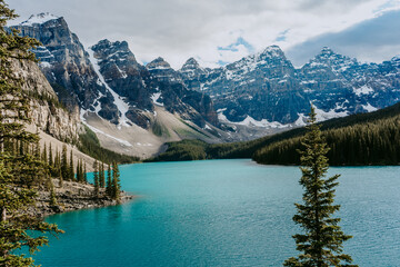 Fototapeta na wymiar Breathtaking view of turquoise water of Moraine Lake, tourist popular attraction/destination in Canadian Rockies, Banff National Park, Alberta, Canada