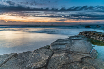 Sunrise Seascape with Clouds and Ships on the Horizon