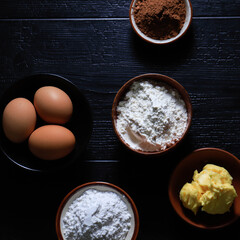 Preparing Baking. Five Bowl with Flour, Chocolate, Butter, Sugar, And Eggs.