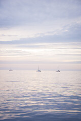 Obraz premium Sunset by the sea, calm and tranquil