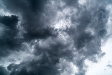 Naklejka na ściany i meble Dark clouds in the sky before heavy rain storm.