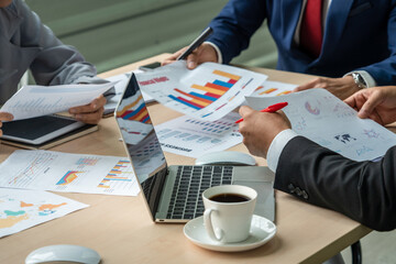 Smart businessman and businesswoman talking discussion in group meeting at office table in a modern...