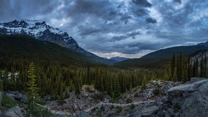 Dark and Moody Cloudy Sunset in the Canadian Rocky Mountain Landscape. Located near Moraine Lake, Banff National Park, Alberta, Canada. Panoramic Nature Background