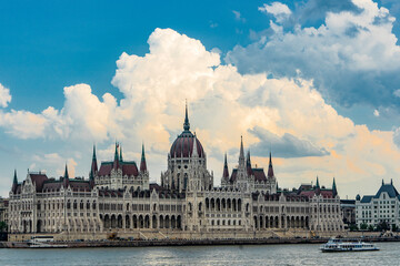 Fototapeta premium The Hungarian Parliament on the Danube under a beautiful sky