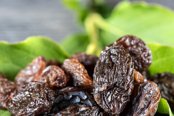 Raisins with reflection. extreme closeup showing detailed texture on blurred background
