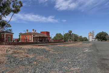 ELMORE, AUSTRALIA - February 29, 2020: The Elmore railway station, water tower and lamp room, with silos in the background