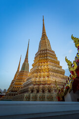 Fototapeta premium BANGKOK, THAILAND -July 6, 2019:Wat Phra Chettuphon Wimon Mangkhalaram Ratchaworamahawihan or the former name Wat Pho, also known as The Temple of the Reclining Buddha, is a Buddhist temple in Phra Na