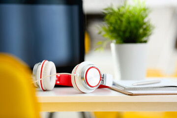 Empty remote office workplace with laptop pc and headset closeup. Receptionist or secretary of...