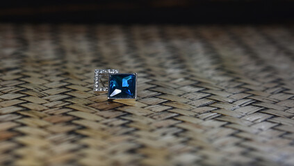 White gold earrings decorated with blue sapphire