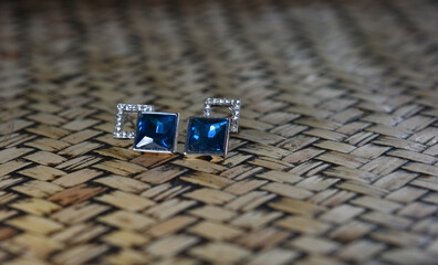 White gold earrings decorated with blue sapphire