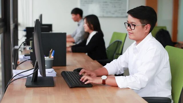 Thai office workers using computer