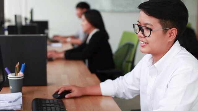 Thai office workers using computer