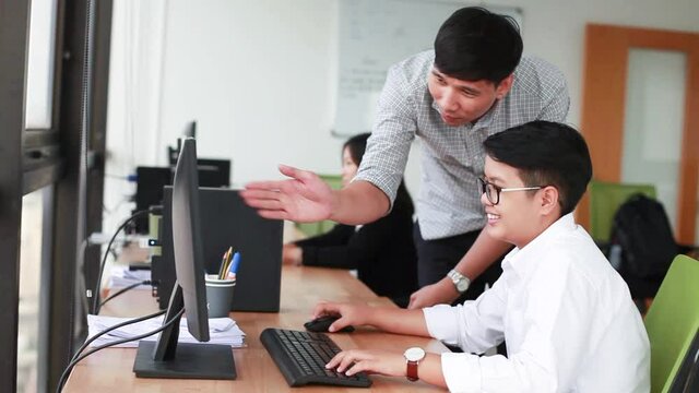 Thai office workers using computer