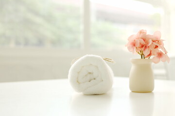 white rose in vase,Spa accessories,Beautiful composition of spa , spa relax concept,  herbs for massage, beautiful spa set on wood table,For marketing products