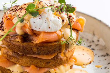 Closeup on salmon cake with poached egg 