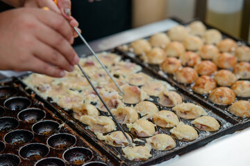 Making of Takoyaki balls. Asian Street food
