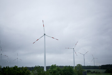 windmill in a field in cloudy weather