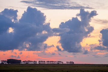 Sunset over a filed in Normandy, France